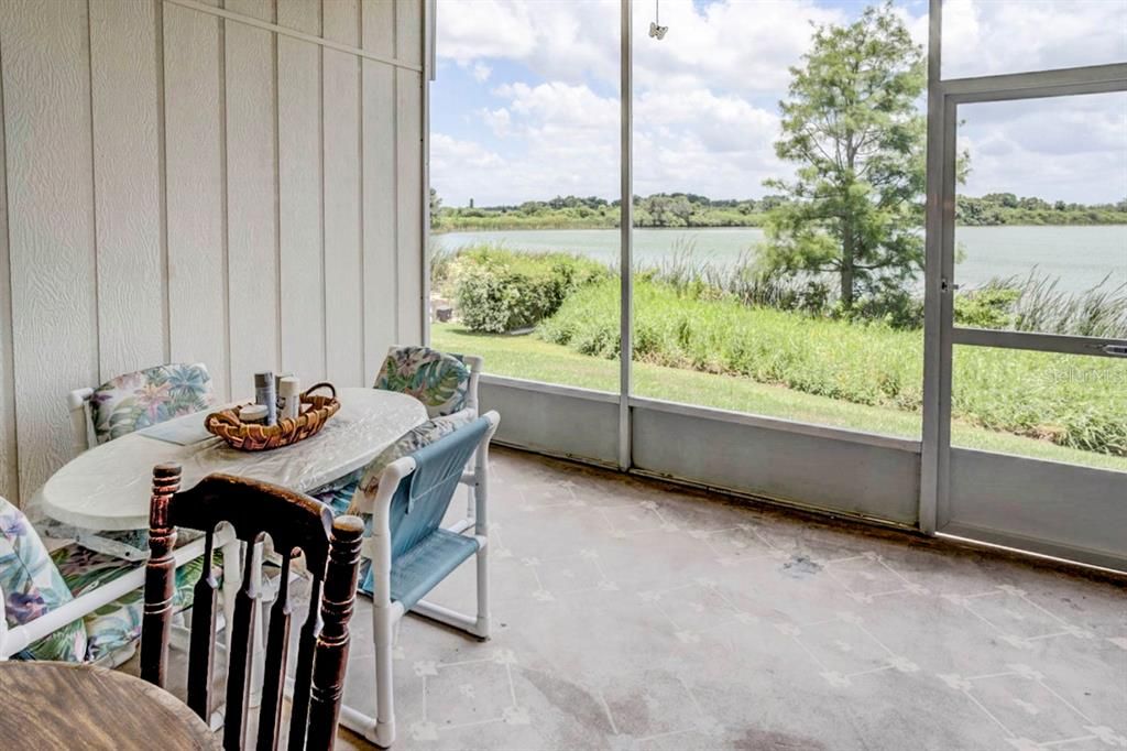 Screen in back porch with the view of the lake.