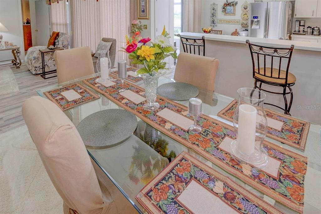 Dining room with view of kitchen and living room.