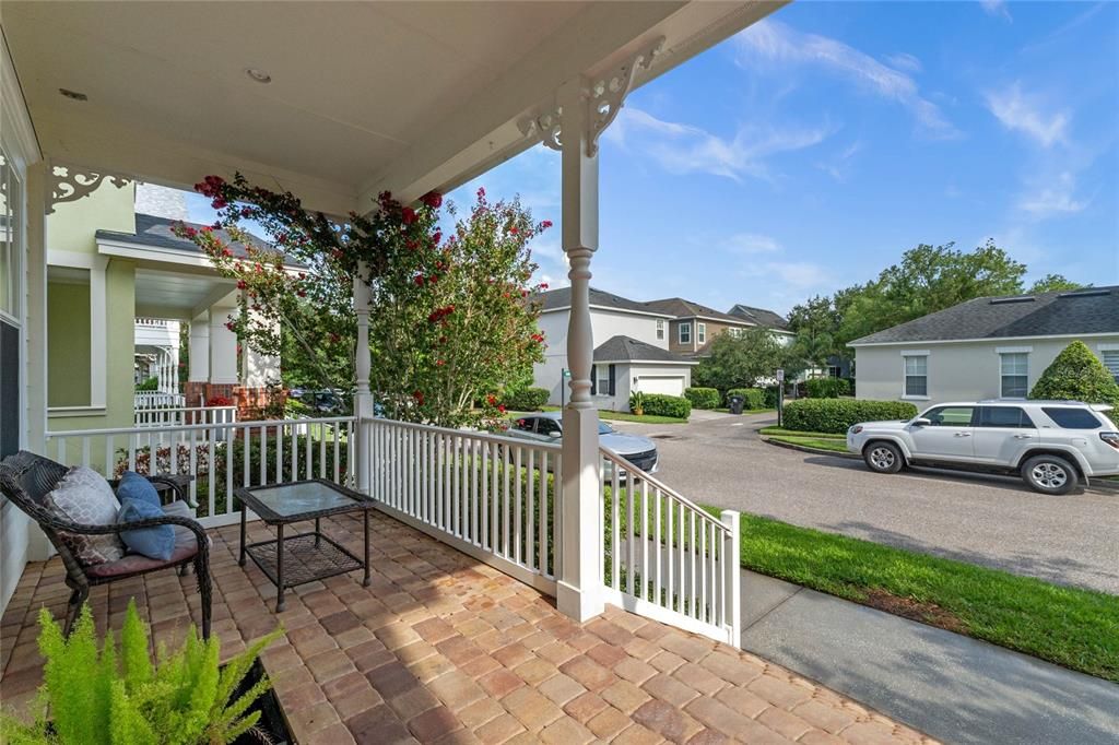 Large front porch overlooks the treelined streets.