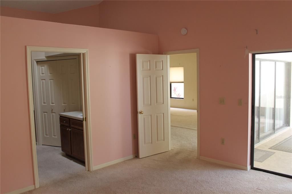 Primary bedroom with access to screened lanai