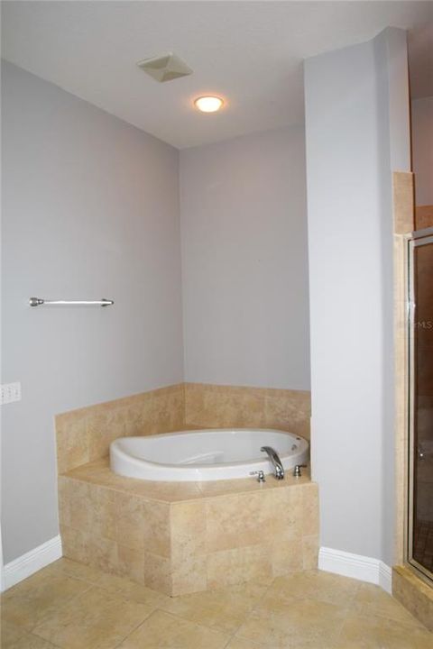 Primary Bath With Soaking Tub Adjacent To Walk-In Shower