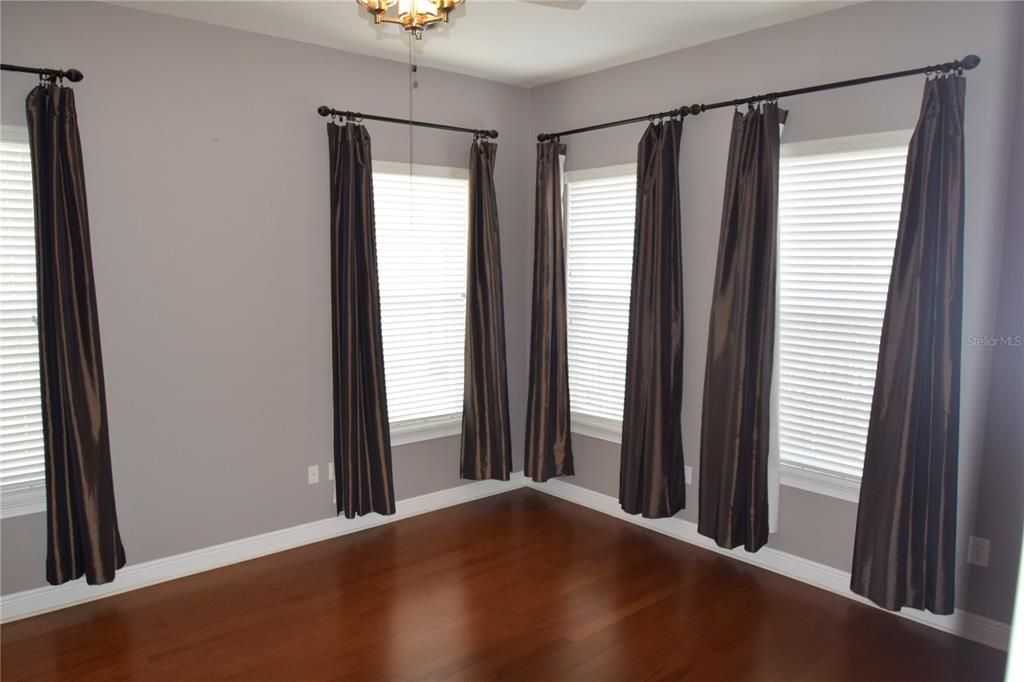 Primary Bedroom With Beautiful Hardwood Floors