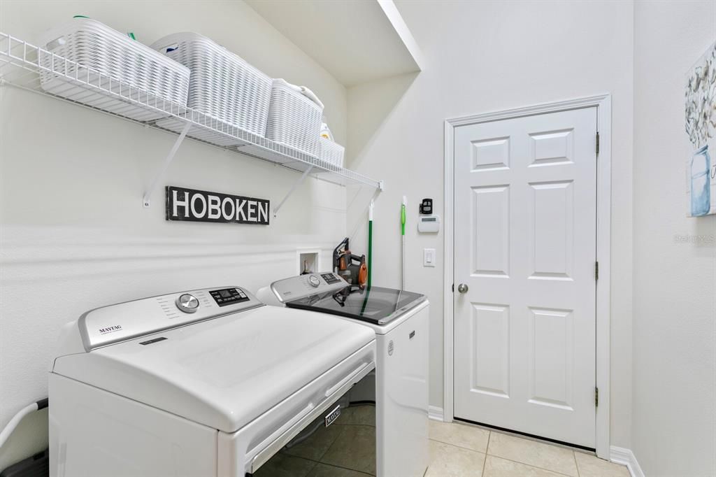 Laundry room off the kitchen leading out to the garage