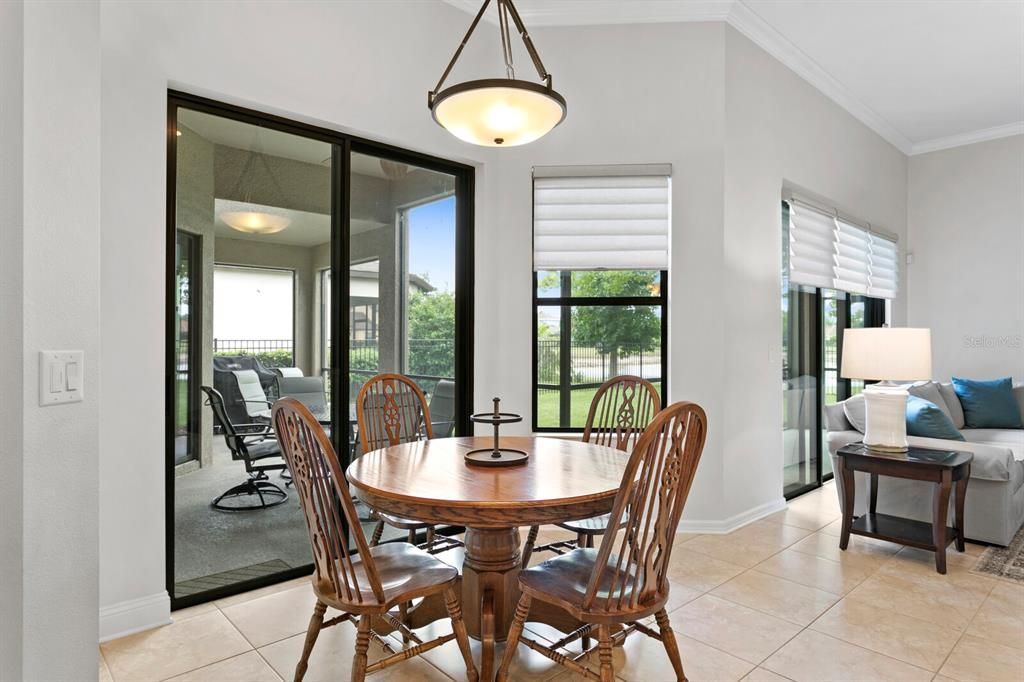 Sliding doors from the casual dining area out to the screened lanai