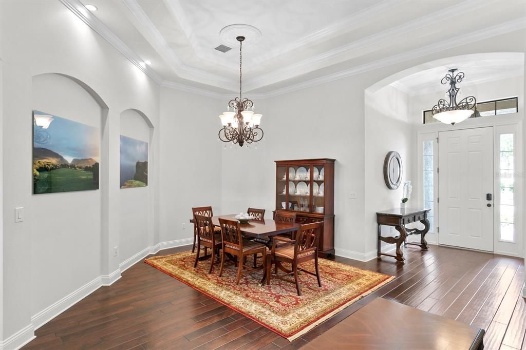 Formal dining room with art niches