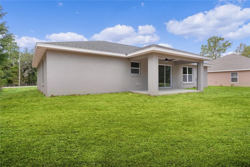 Rear of the home with large covered lanai