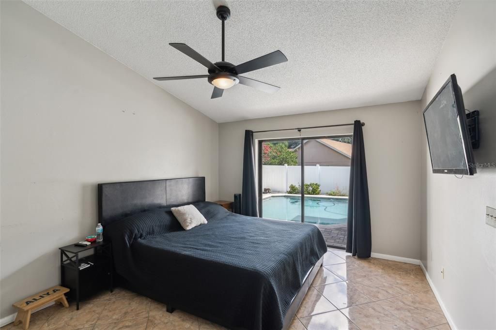 Primary Bedroom with Sliding Doors to Pool Deck