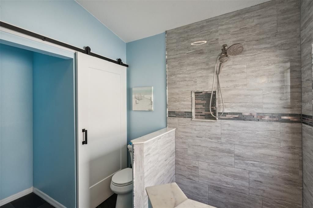 Primary Bathroom with Barn Door to Multi-Use Closet Space