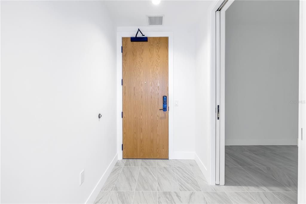 Entry into the Quartz floorplan, with den with pocket doors included