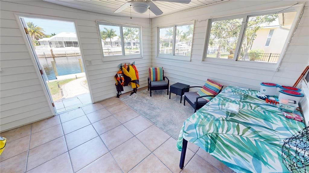 Enclosed flex room of lanai with access to backyard