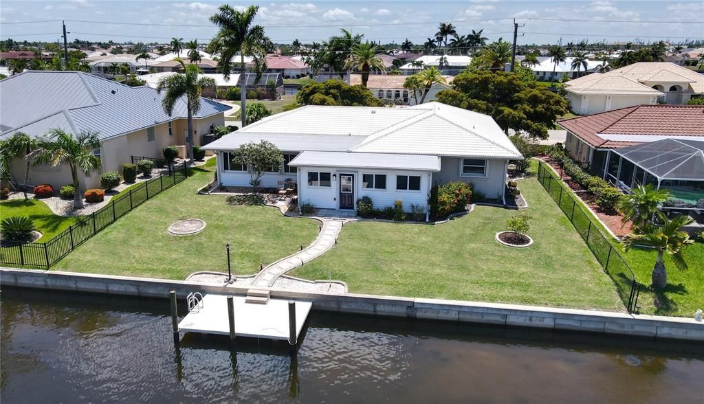 Aerial view of home and waterfront