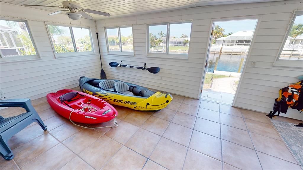 Enclosed flex room of lanai with access to backyard