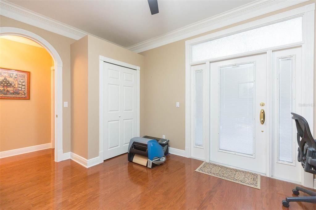 Door to the screened in breezeway and additional storage closet