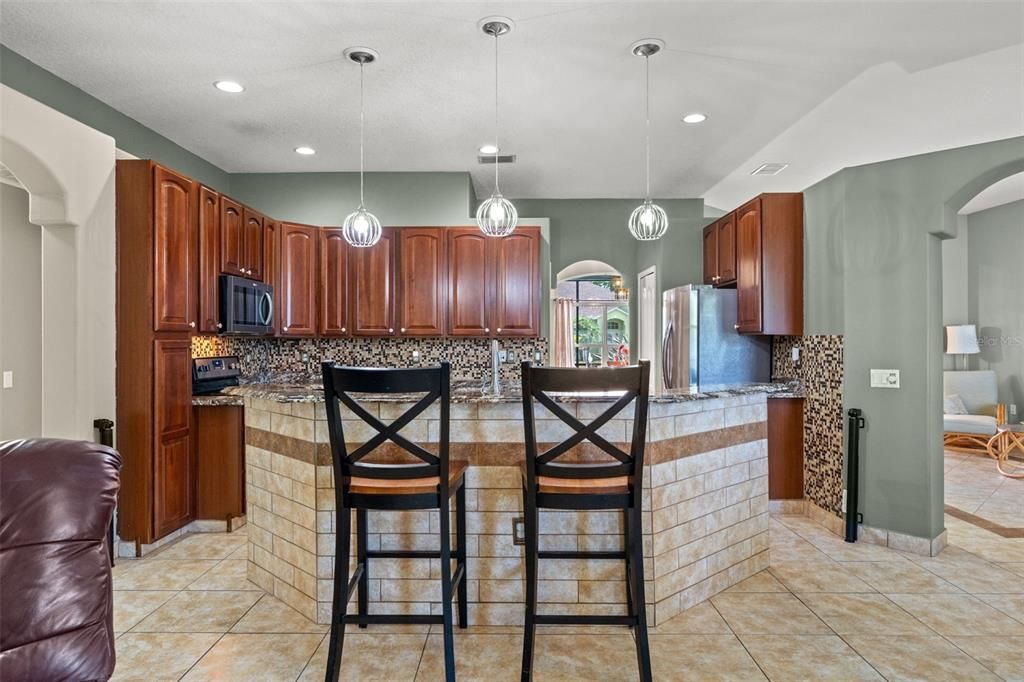 Kitchen Island with Stone Backsplash