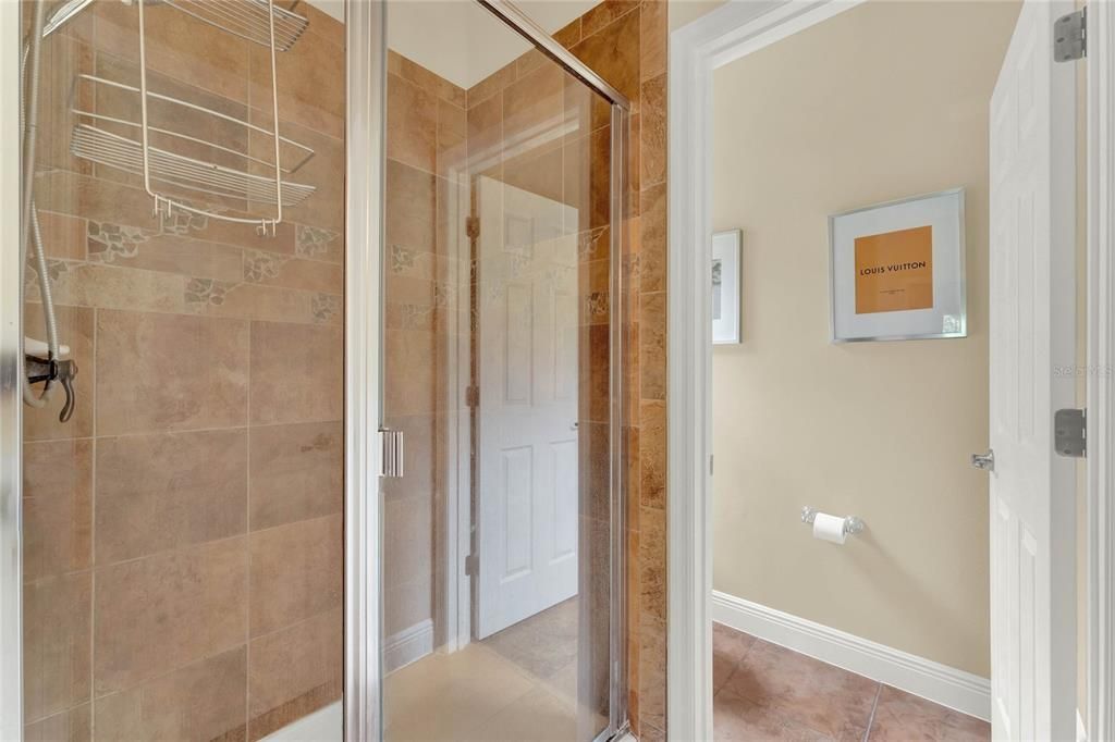 Master bathroom with tub and walk-in shower