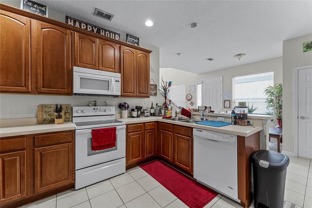 A view from the kitchen to the breakfast area.