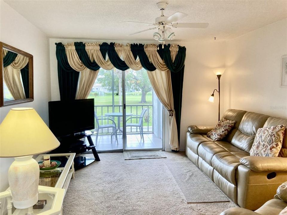 Living room with sliding doors to porch.