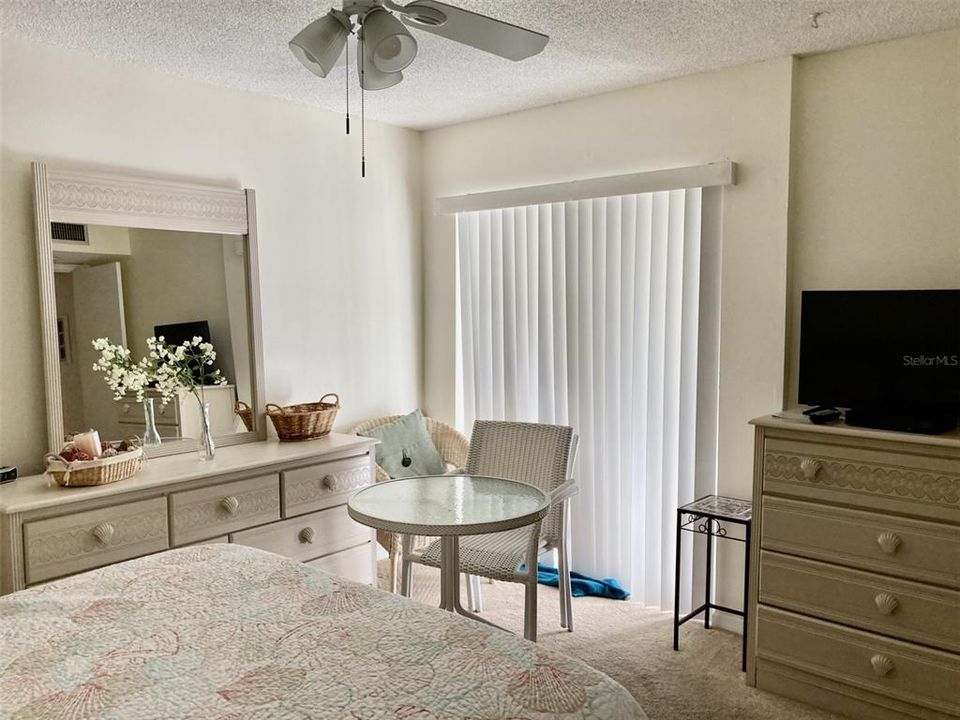 Master bedroom with sliding doors to porch.