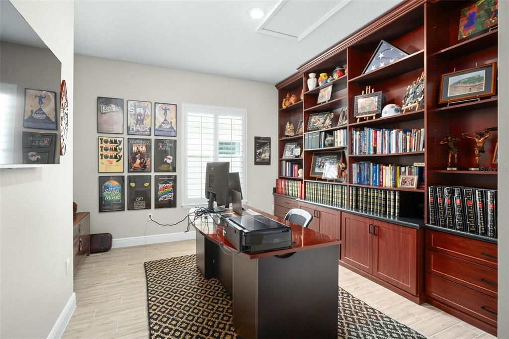 Beautiful fourth bedroom or office with custom built-ins.