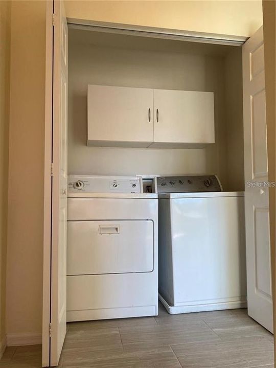 Upstairs, you'll find a laundry closet with a stand alone washer and dryer.