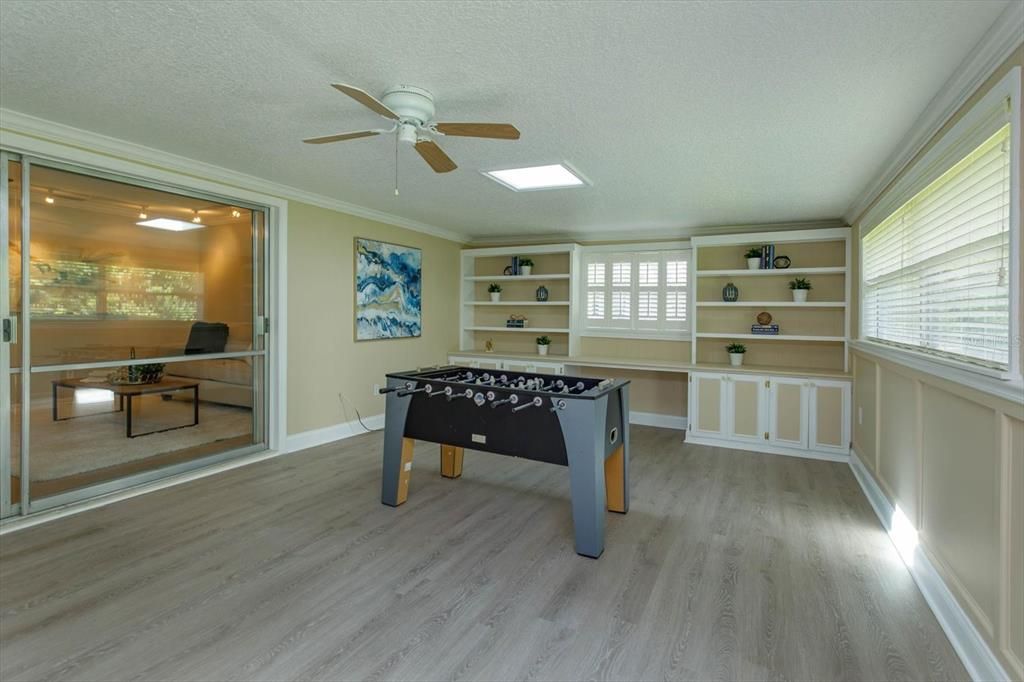 36' x 14' Florida room with built-in shelving