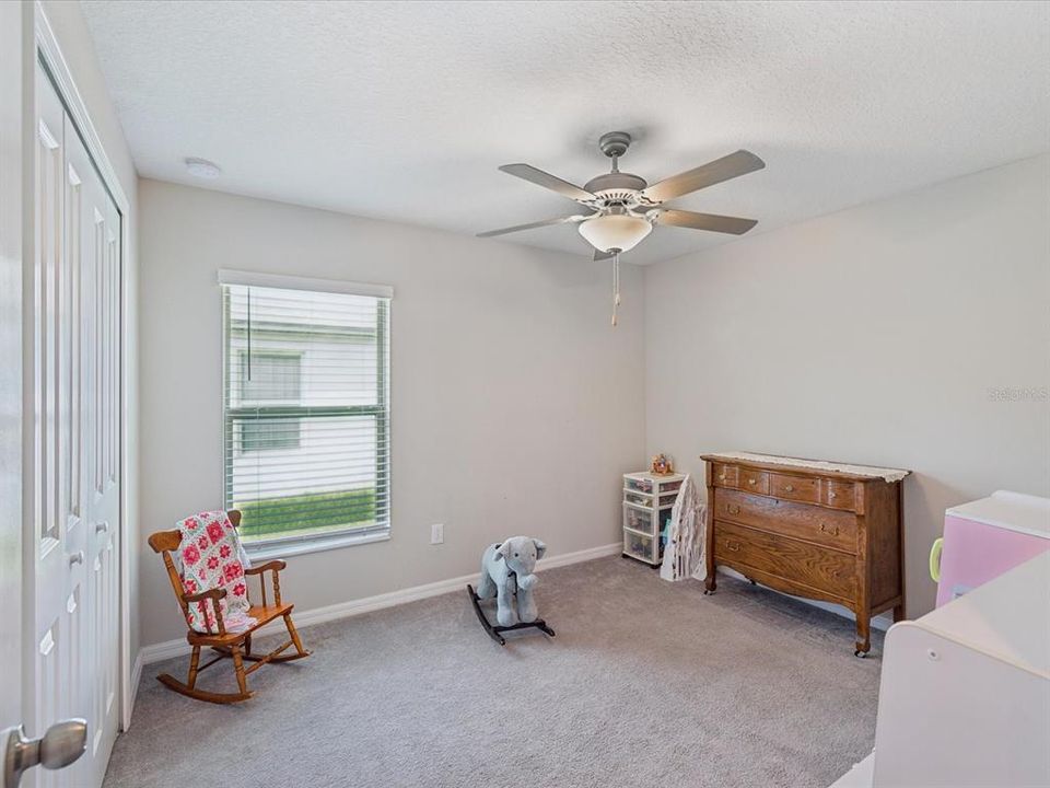 Guest bedroom currently used as a kid's playroom