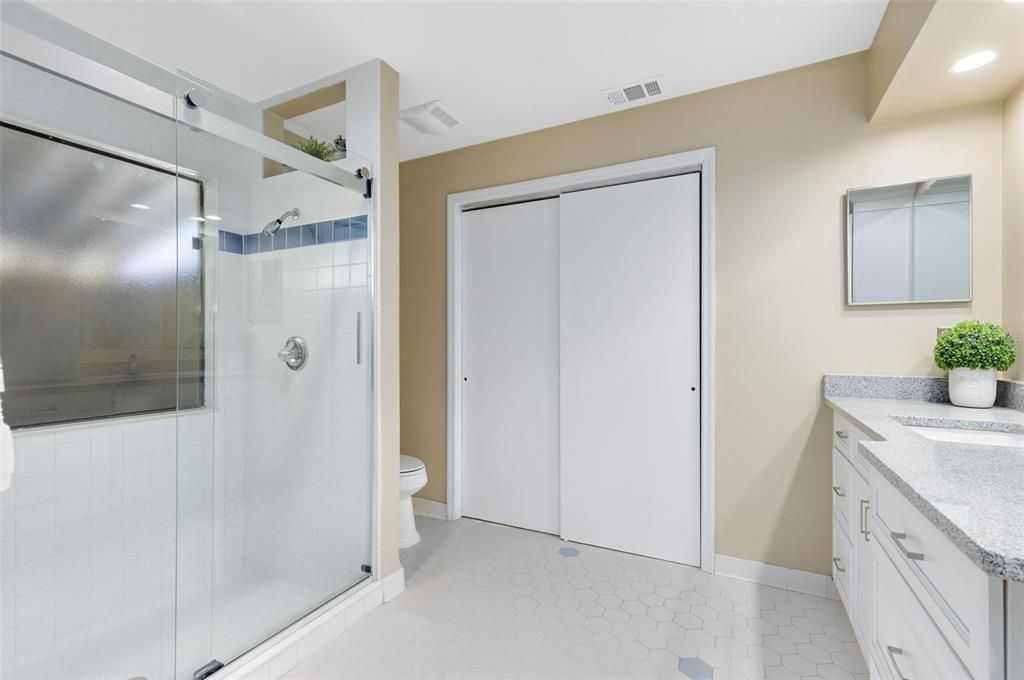 Lovely updated master bathroom with amazing walk in shower and large dual vanity.