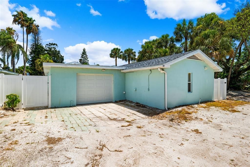 1 car garage with alley access and additional parking for 2 cars.