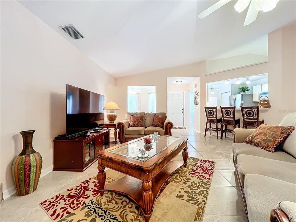 Another view of the living room with the kitchen in the background.