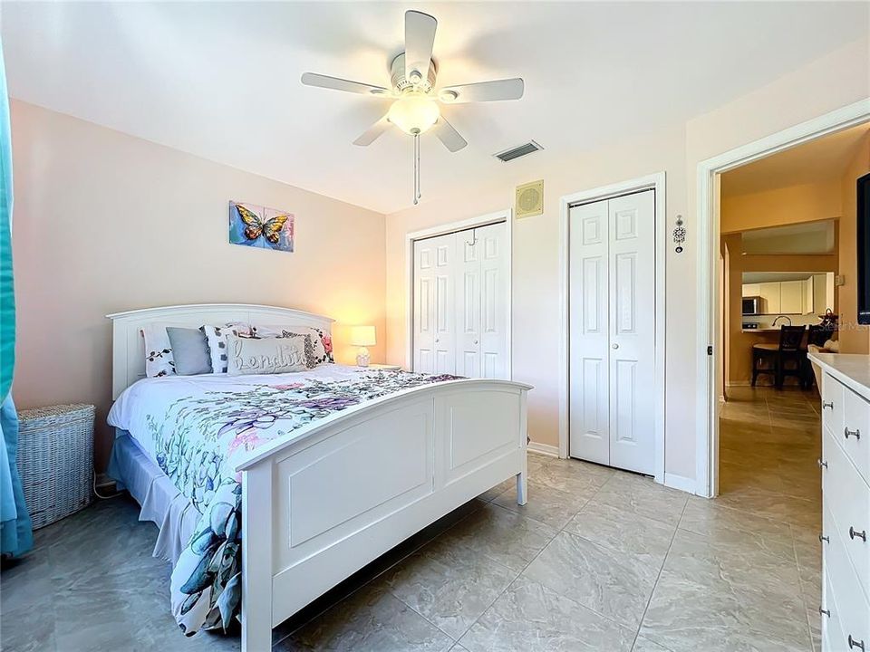 Guest bedroom with two separate closets.