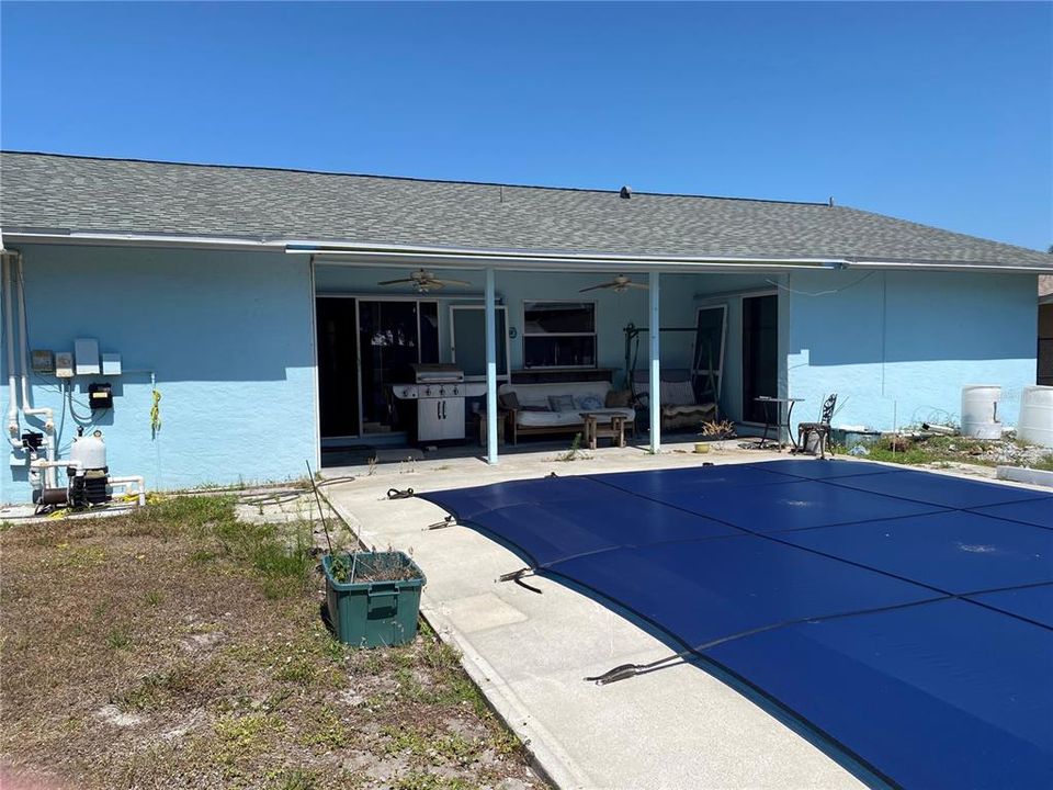 Back of home, covered lanai and pool.