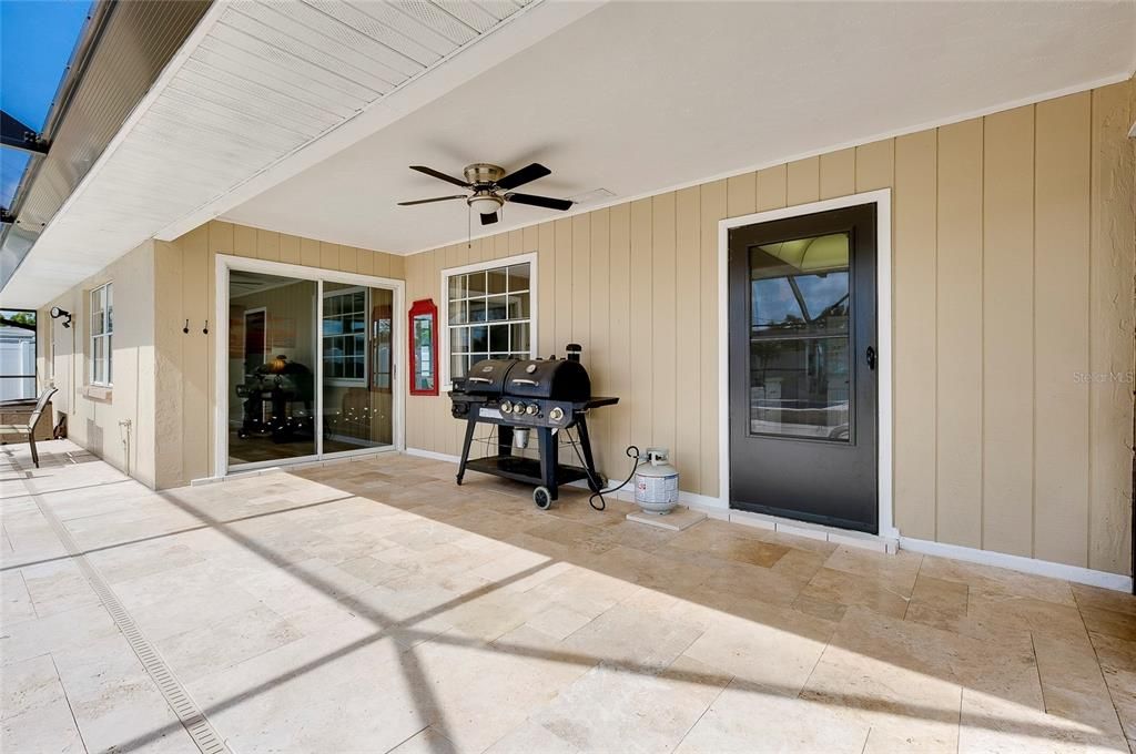 Lanai with sliders to living room and door to kitchen.