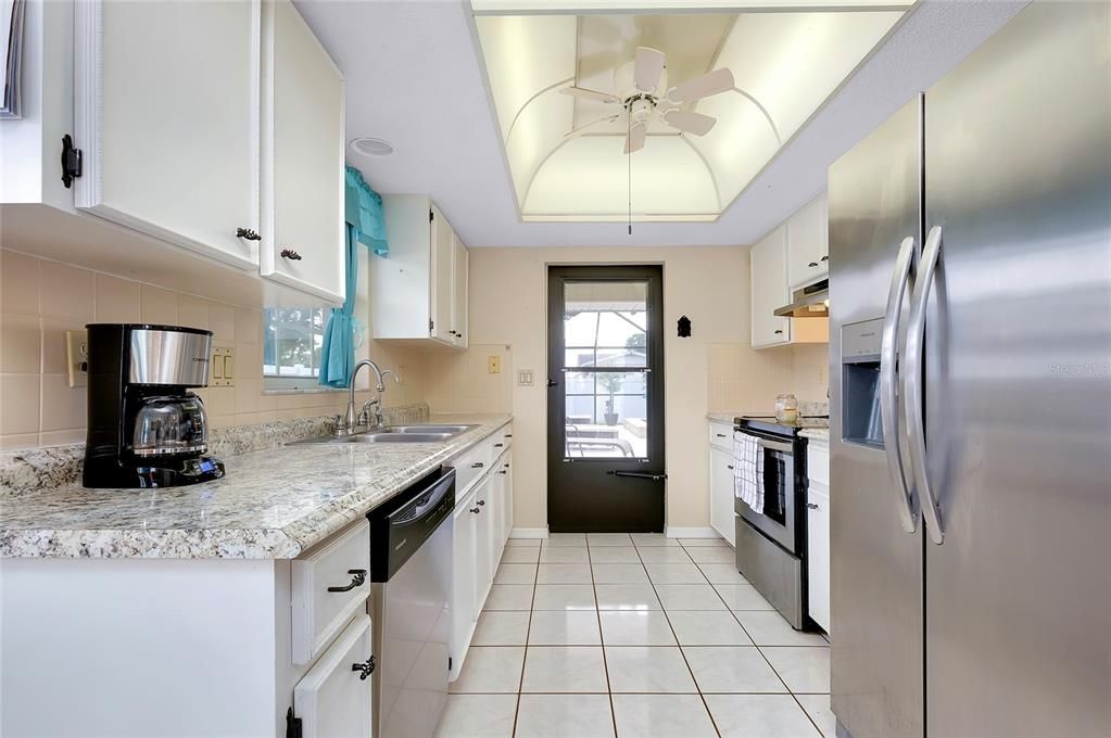 Kitchen with access to lanai area.