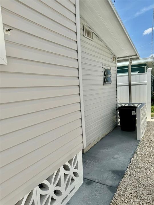 Behind shed garbage can storage