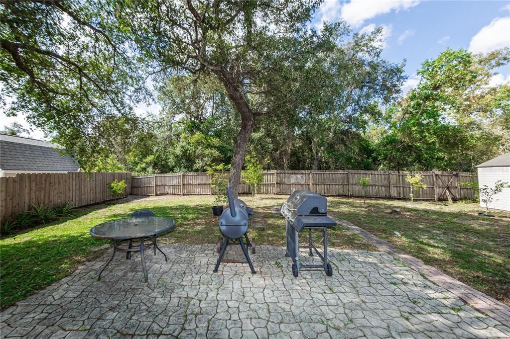 Back yard with cobblestone floor area