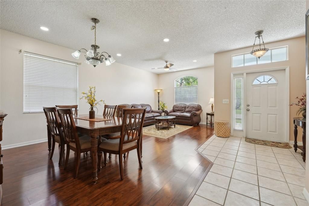 A large entryway leads right into your FORMAL LIVING and FORMAL DINING spaces highlighted by NEWER LAMINATE FLOORING, UPGRADED FIXTURES and FRESH INTERIOR PAINT.