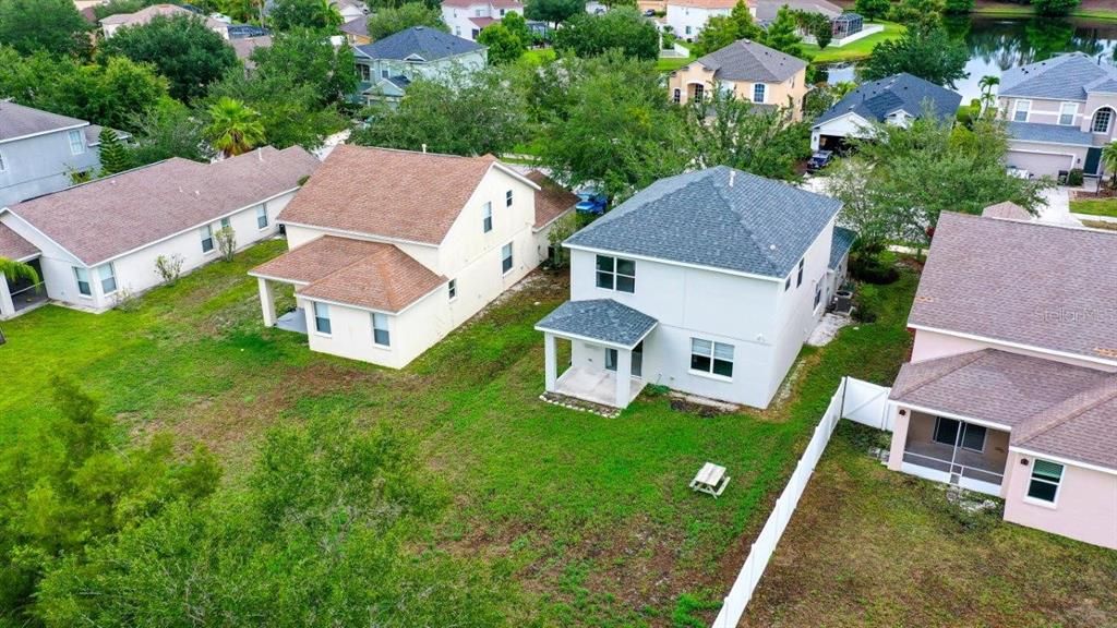 Aerial showing the rear elevation and large back yard.