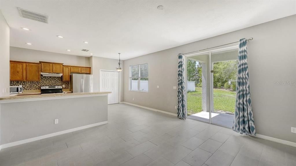 Living room featuring sliding glass doors to the covered lanai.