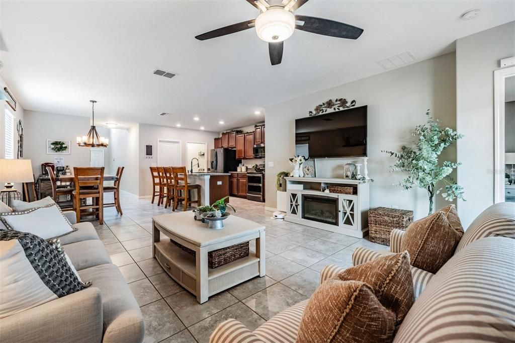 living room with views of kitchen and dining