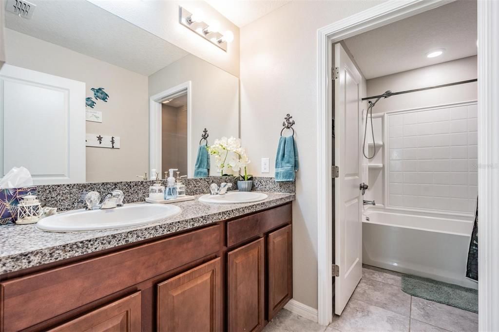 upstairs bathroom dual sinks and separate bath