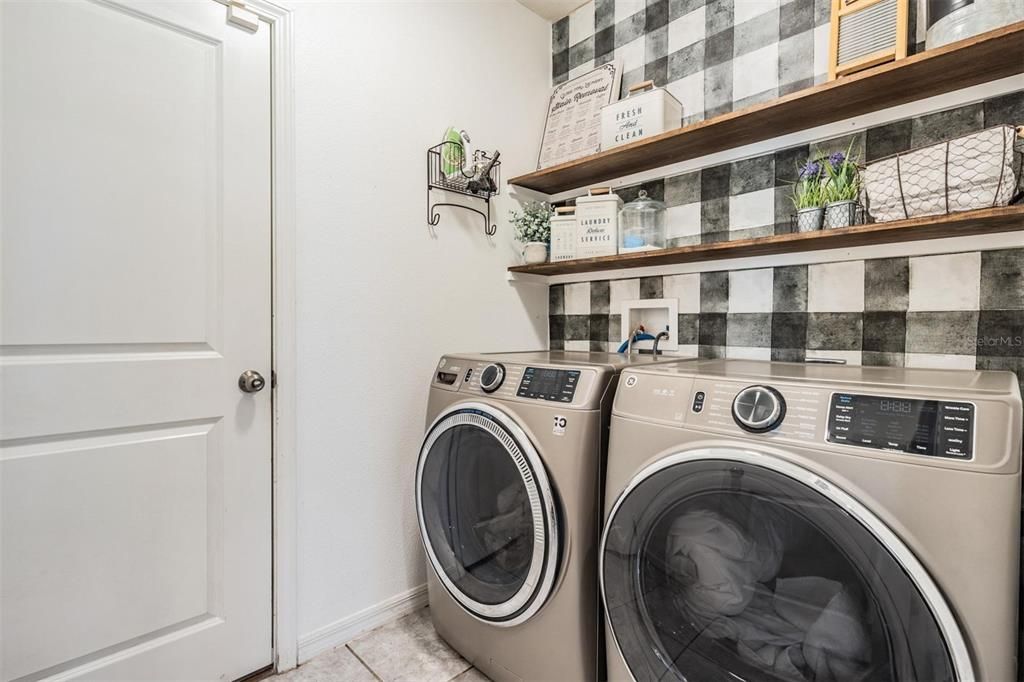 laundry room with door leading to garage