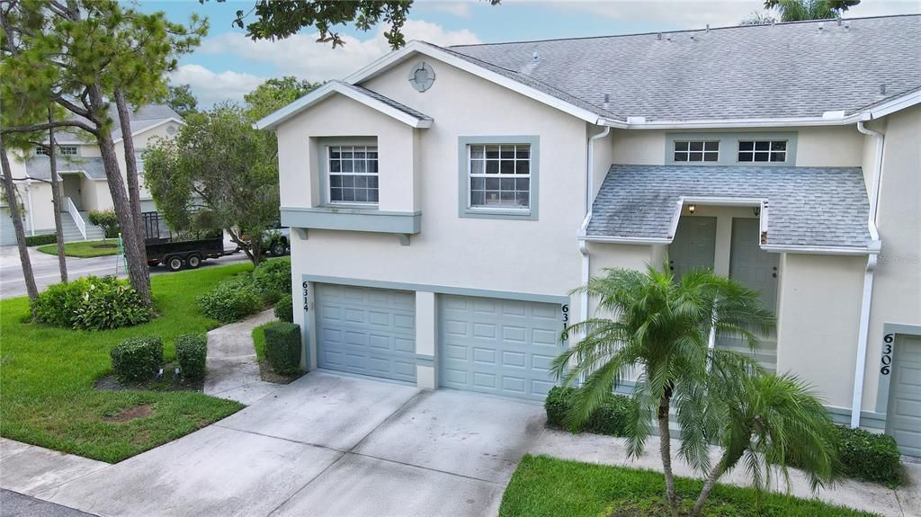 Front Elevation showing the attached one car garage.