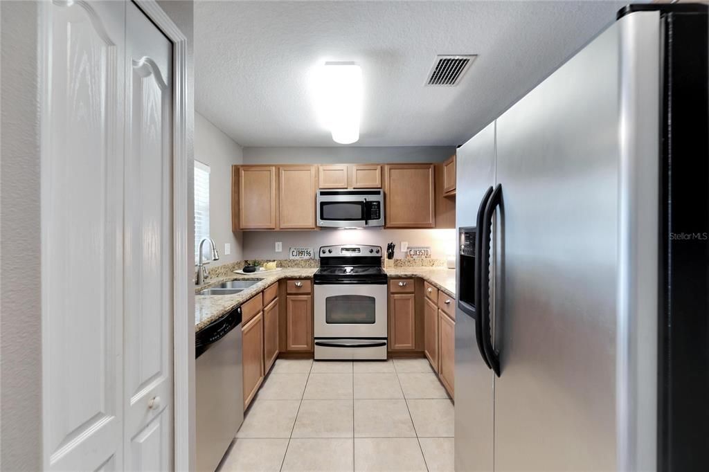 Stainless steel appliances, tile flooring and granite counter tops offer beauty and function.