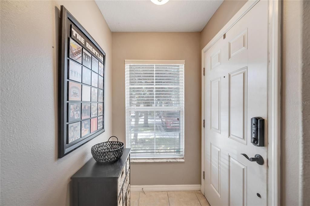 Entry Hall with tile flooring greets you home.