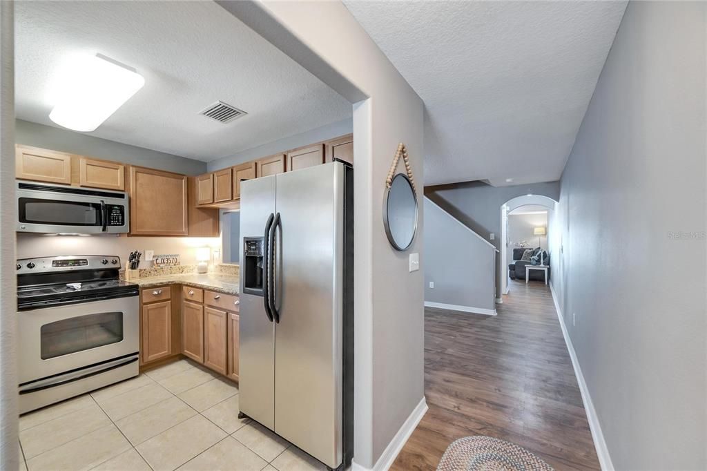 Property opens up to engineered hardwood floors on the main level.