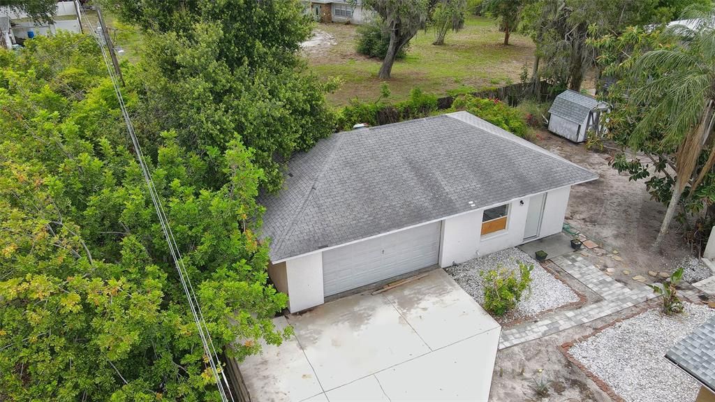 The aerial view of the two-car garage and extra two rooms in the detached garage.