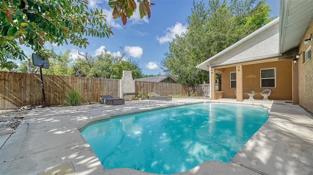 The view of the pool from the rear yard.