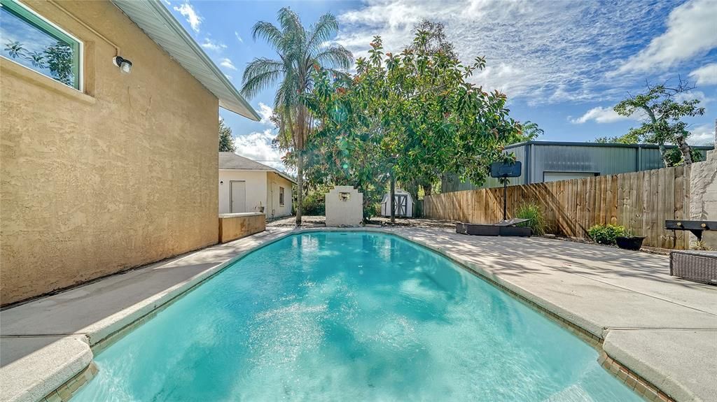 The view of the pool from the rear porch.