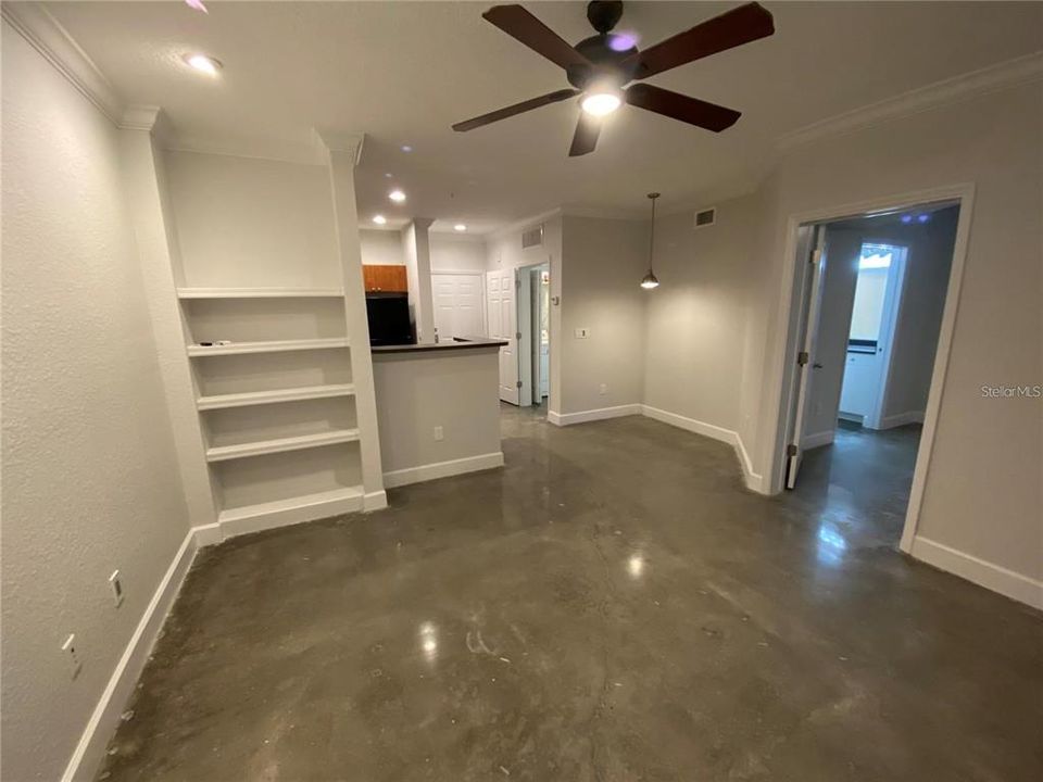 Great Room w/ built in bookcases, ceiling fan (& TV mount not pictured)