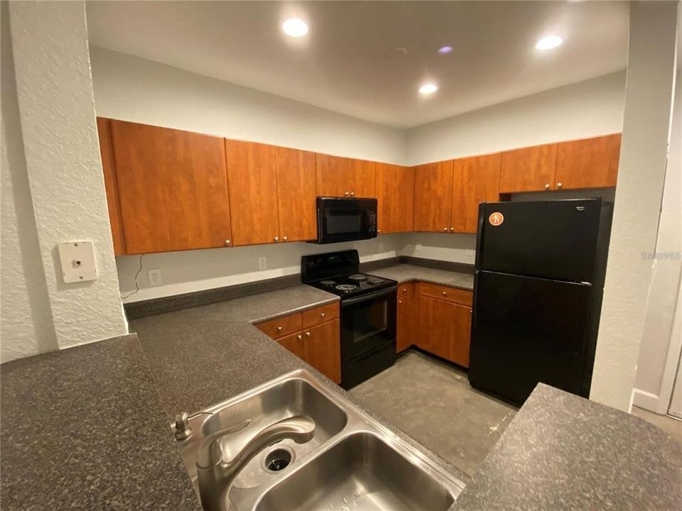 Kitchen with Can Lighting & Microwave